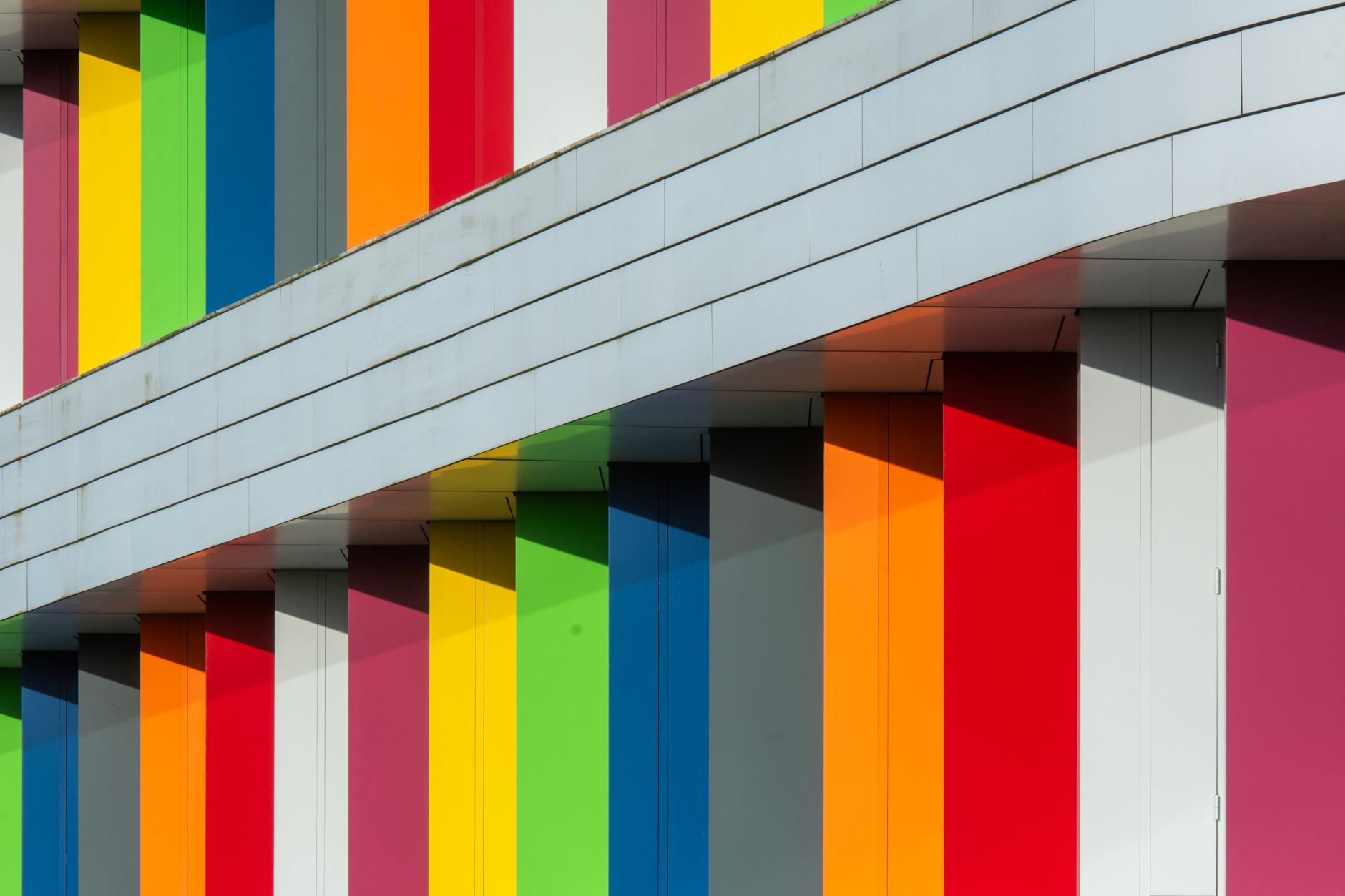 A colourful panelled facade on a renovated apartment block in Zoetermeer.